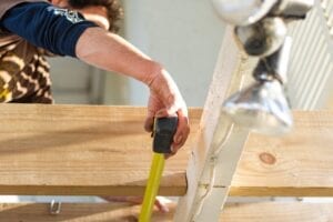 builder using measuring tape