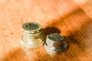 Pound coins stacked on a table